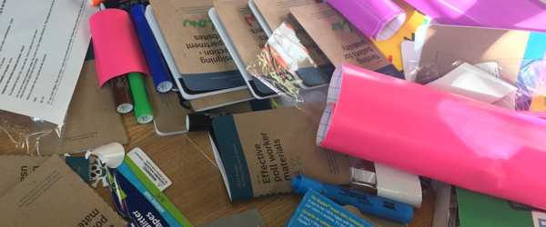 Pile of materials and Field Guides with student names on them