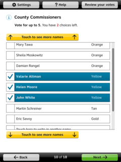 A contest on an interactive ballot. Three candidates are selected. A messages says that "you have two choices left" There are large yellow buttons at the top and bottom that say Touch to see more names.